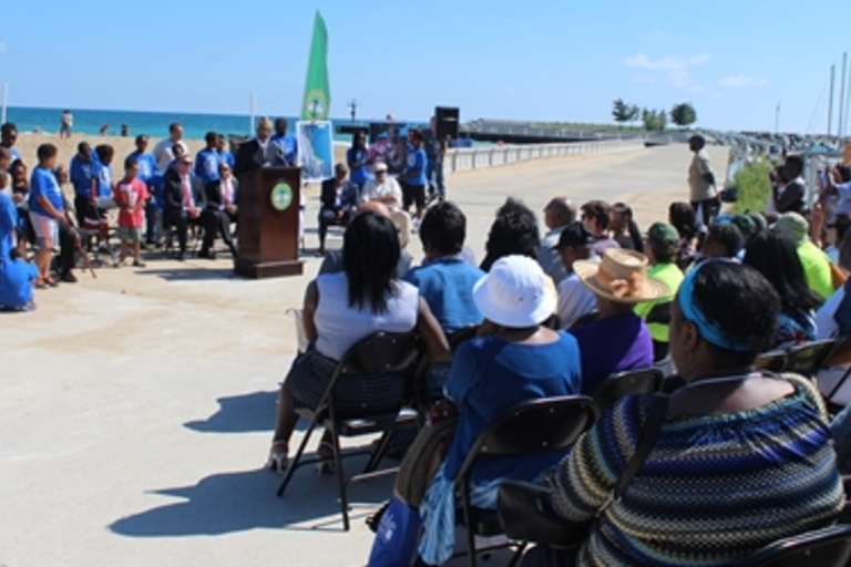 Crowd attends lakeside ceremony.