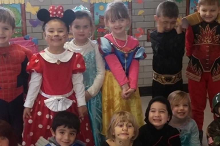 Children dressed in costumes for a dress-up day at school.
