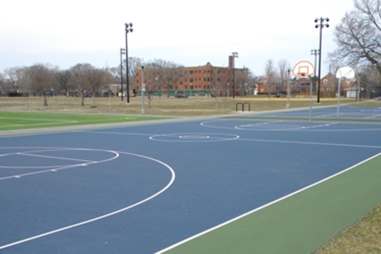 Outdoor basketball courts with a green border.