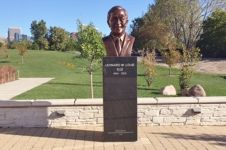 Bronze bust of Leonard M. Louie Jr. on a rectangular pedestal.
