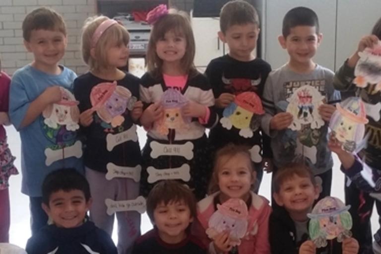 Preschool class displays their dog-themed art projects.
