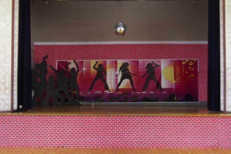 Empty stage decorated for a dance party.