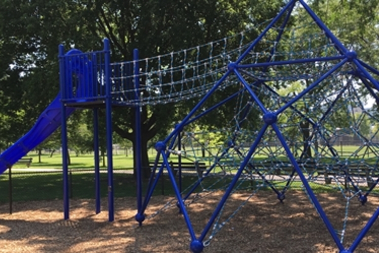Blue playground slide and climbing dome.
