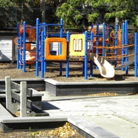 Colorful playground with climbing structures and slides.