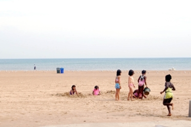 Children playing on a sandy beach.
