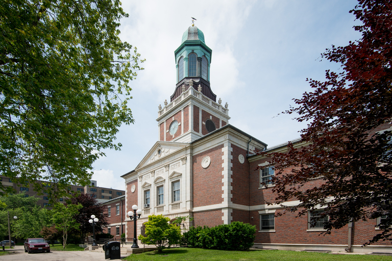 Austin Town Hall, a brick building with a clock tower and green cupola.