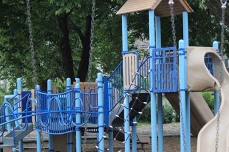 Blue and tan playground structure with slide.