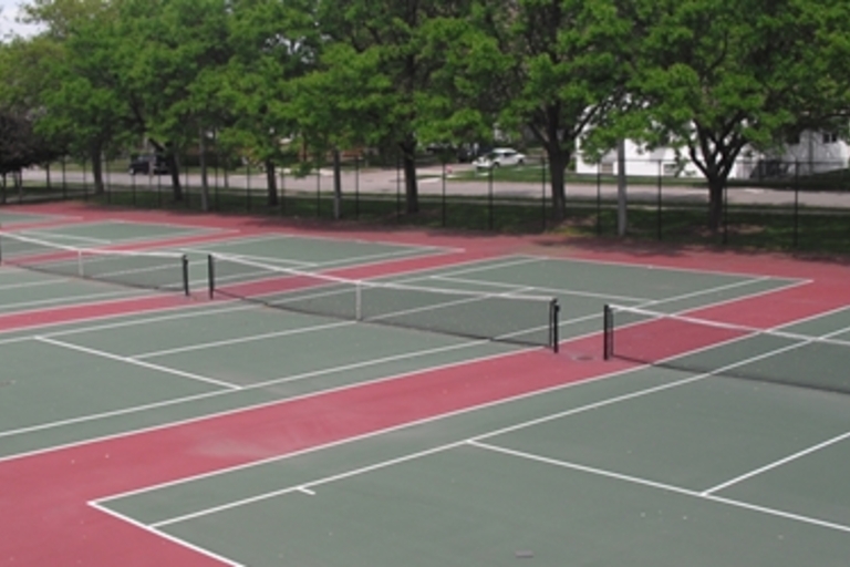 Several red and green tennis courts.