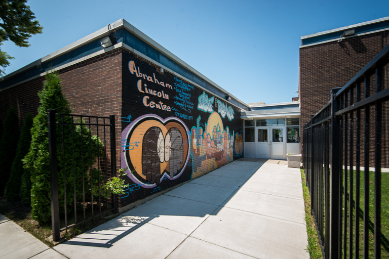 Abraham Lincoln Centre exterior wall mural with two hands clasped.