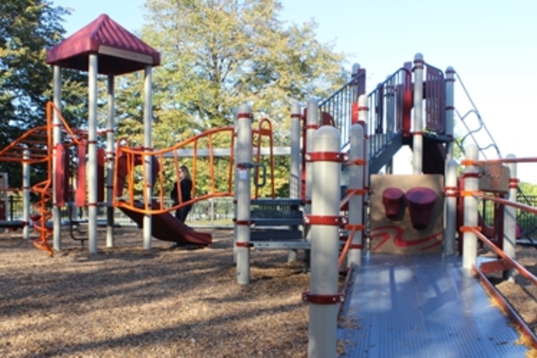 Accessible playground with ramps and climbing structures.
