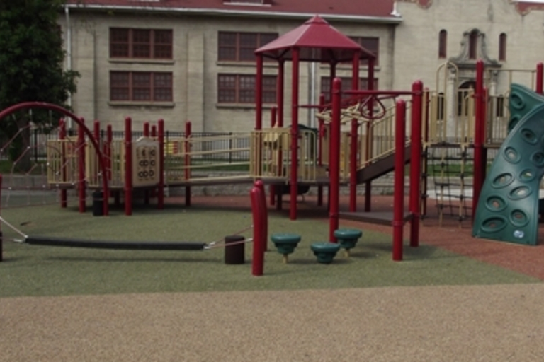 Colorful playground with slides and climbing structures.