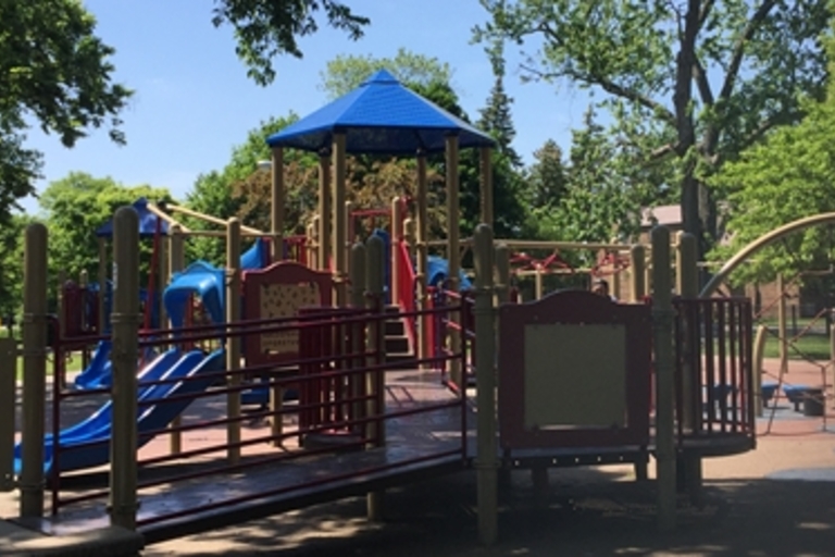 Colorful playground with ramps and slides on a sunny day.