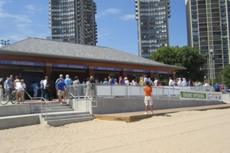 Crowd gathers at beach house grand opening.