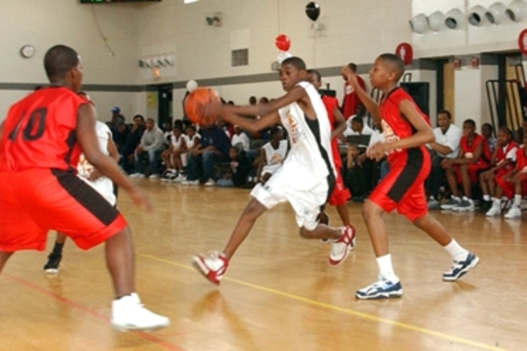 Youth basketball game action.
