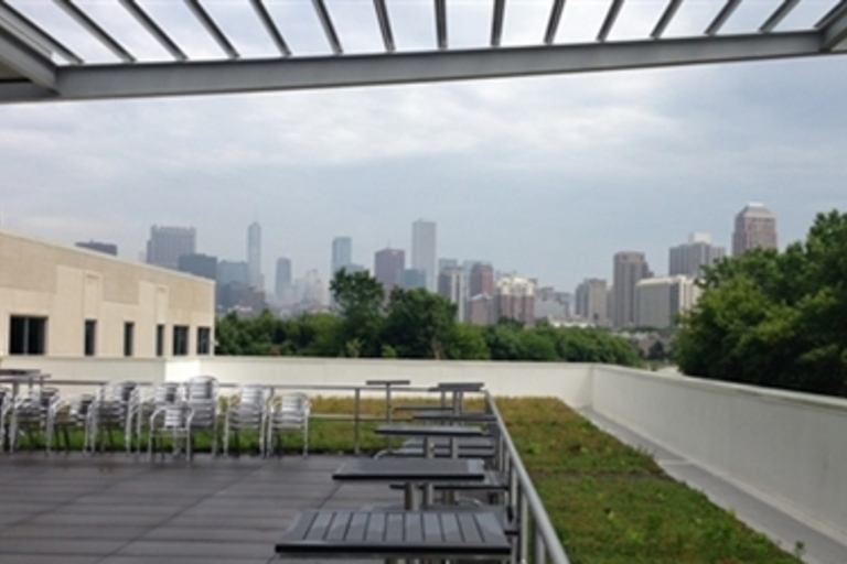 Rooftop patio with city view.