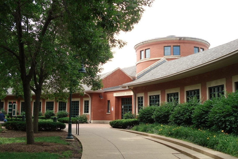 Harrison Park field house with a curved walkway leading to the entrance.