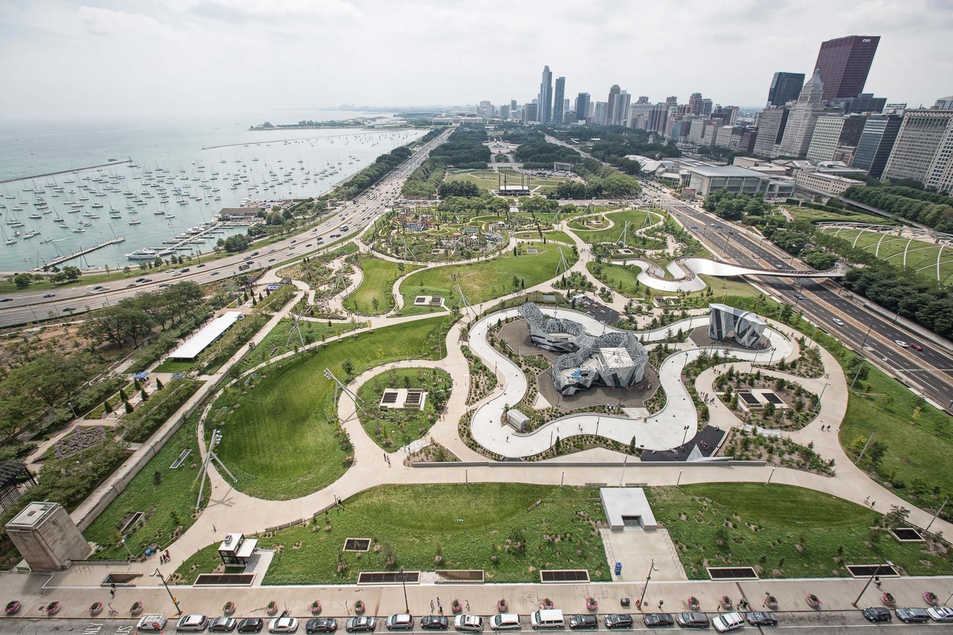 Aerial view of Maggie Daley Park, Chicago, with Lake Michigan and city skyline in background.