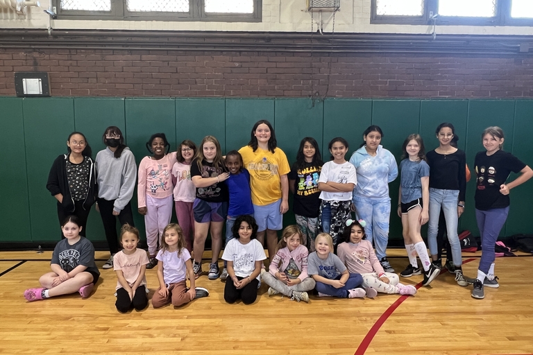 Group photo of girls in a gym.