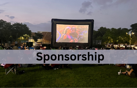 An image showing a movie playing in a park