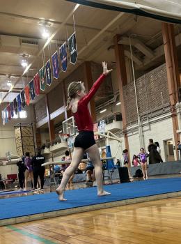 Young gymnast performing a floor routine.