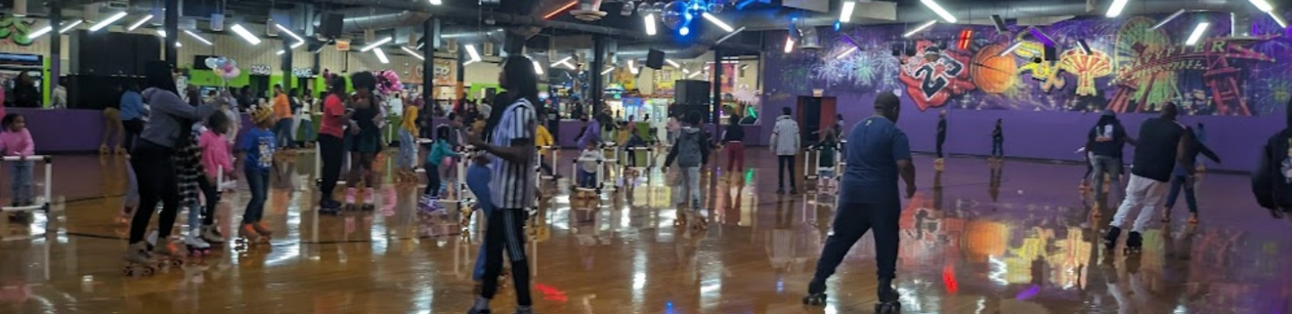 People roller skating at a rink.